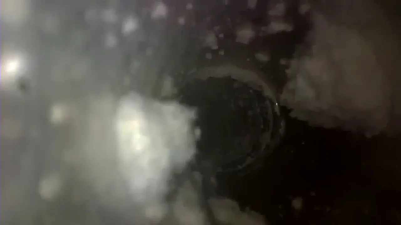 Inspection camera view of clumped debris inside a circular air duct